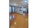 Bright living room featuring sleek laminate flooring, lots of natural light, and a modern neutral color scheme at 7224 W Pioneer St, Phoenix, AZ 85043