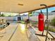 Outdoor space includes covered back porch with grill, Everlast punching bag, and fenced in yard at 7940 W Avalon Dr, Phoenix, AZ 85033