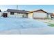 Home featuring a large driveway, attached garage, and lawn at 7940 W Avalon Dr, Phoenix, AZ 85033