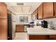Traditional-style kitchen with stainless steel appliances, light countertops, wood cabinets, and tile backsplash at 839 S Westwood -- # 287, Mesa, AZ 85210