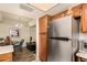 Efficient kitchen with stainless steel refrigerator and ample cabinet space near a dining area at 839 S Westwood -- # 287, Mesa, AZ 85210