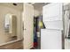 Functional laundry area equipped with a stackable washer-dryer unit and efficient water heater at 839 S Westwood -- # 287, Mesa, AZ 85210