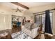 Comfortable living room features wood floors, a slider door, and a view into the dining area and kitchen at 839 S Westwood -- # 287, Mesa, AZ 85210