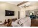 Open living area features wood floors, neutral paint, ceiling fan, flat screen television, and access to dining area at 839 S Westwood -- # 287, Mesa, AZ 85210