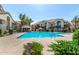 Community pool surrounded by well-maintained landscaping, buildings and lounging areas, perfect for relaxation at 839 S Westwood -- # 287, Mesa, AZ 85210