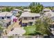 Expansive aerial view of the private backyard with a well-maintained lawn and a covered patio at 869 W Shellfish Dr, Gilbert, AZ 85233