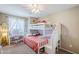 Cozy bedroom with a white bunk bed, vanity, and soft carpeting at 869 W Shellfish Dr, Gilbert, AZ 85233