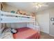 Bedroom with a white bunk bed with stairs and ample storage space at 869 W Shellfish Dr, Gilbert, AZ 85233