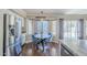 Bright dining area featuring a round table, four velvet chairs, and a stainless steel refrigerator at 869 W Shellfish Dr, Gilbert, AZ 85233