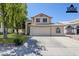 Charming two-story home featuring a neutral color scheme, tile roof, and a well-manicured front lawn at 869 W Shellfish Dr, Gilbert, AZ 85233