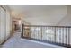 Upstairs hallway with decorative railing looking towards the front door and stairs at 869 W Shellfish Dr, Gilbert, AZ 85233