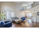Bright and airy living room with high ceilings, hardwood floors, and comfortable seating area at 869 W Shellfish Dr, Gilbert, AZ 85233