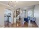Inviting living room seamlessly connects to the kitchen, featuring hardwood floors, and natural light at 869 W Shellfish Dr, Gilbert, AZ 85233