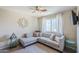 A comfortable living room with ample seating and a ceiling fan for added comfort at 869 W Shellfish Dr, Gilbert, AZ 85233