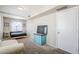 Bedroom featuring neutral walls, TV, and a window with lots of natural light at 869 W Shellfish Dr, Gilbert, AZ 85233