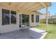 Covered patio overlooking the well-manicured backyard at 869 W Shellfish Dr, Gilbert, AZ 85233