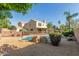Spacious backyard with a pool, mature trees, and privacy fencing at 9121 E Karen Dr, Scottsdale, AZ 85260