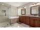 Bathroom featuring a shower, soaking tub, marble floors and double vanity at 9121 E Karen Dr, Scottsdale, AZ 85260