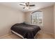 Bedroom featuring a ceiling fan, natural light and comfortable carpet flooring at 9121 E Karen Dr, Scottsdale, AZ 85260