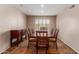 Traditional dining room featuring a dark wood table and chairs, a buffet and tiled flooring at 9121 E Karen Dr, Scottsdale, AZ 85260
