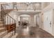 Grand foyer featuring high ceilings, staircase, and views of the dining area at 9121 E Karen Dr, Scottsdale, AZ 85260