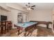 Spacious game room featuring a pool table and shuffleboard table, perfect for entertaining guests at 9121 E Karen Dr, Scottsdale, AZ 85260