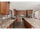 Well-equipped kitchen boasts granite countertops, stainless steel appliances, and ample cabinet space at 9121 E Karen Dr, Scottsdale, AZ 85260