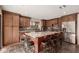 Modern kitchen featuring stainless steel appliances, a granite island, and custom wood cabinetry at 9121 E Karen Dr, Scottsdale, AZ 85260