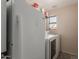 Laundry room with washer, dryer, and window at 9121 E Karen Dr, Scottsdale, AZ 85260