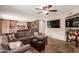 Living room showcasing seamless flow to the kitchen, complete with modern furniture and ample lighting at 9121 E Karen Dr, Scottsdale, AZ 85260