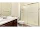 Clean bathroom with wood look flooring, a shower, and light countertops at 9452 W Parkside Ln, Peoria, AZ 85383