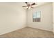 Bedroom with neutral paint, carpet flooring, ceiling fan and window at 9452 W Parkside Ln, Peoria, AZ 85383