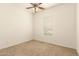 Bedroom featuring plush carpet and window, providing natural light at 9452 W Parkside Ln, Peoria, AZ 85383