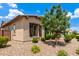 Charming single-story home with desert landscaping, a well-maintained yard, and dark shutters at 9452 W Parkside Ln, Peoria, AZ 85383