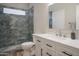 Stylish bathroom boasts a glass-enclosed shower, sleek vanity, and elegant finishes, offering a spa-like experience at 10490 E Morning Star Dr, Scottsdale, AZ 85255