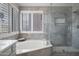 Serene bathroom with separate tub and shower, complemented by modern fixtures and natural light, creating a relaxing oasis at 10490 E Morning Star Dr, Scottsdale, AZ 85255