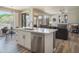 Kitchen island with sink views into living room and backyard at 10490 E Morning Star Dr, Scottsdale, AZ 85255