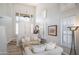 Light and bright living room with high ceilings, neutral decor, and plenty of natural light from large windows at 10490 E Morning Star Dr, Scottsdale, AZ 85255