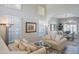 Bright living room with white walls, shuttered windows, and open-concept layout to the dining area at 10490 E Morning Star Dr, Scottsdale, AZ 85255
