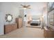 Expansive main bedroom with sitting area, decorative mirror and neutral walls, creating a serene retreat at 10490 E Morning Star Dr, Scottsdale, AZ 85255