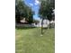 Tranquil backyard view featuring lush greenery and mature trees, perfect for relaxation at 1121 W Windjammer Dr, Gilbert, AZ 85233