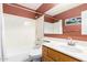 Functional bathroom featuring a sink, mirror, shower and bathtub combo at 1121 W Windjammer Dr, Gilbert, AZ 85233