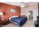 Comfortable bedroom showcasing a ceiling fan and a queen sized bed at 1121 W Windjammer Dr, Gilbert, AZ 85233