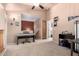 Spacious bonus room with a ceiling fan, piano, and staircase to the second floor at 1121 W Windjammer Dr, Gilbert, AZ 85233