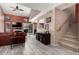 Inviting living room featuring wood-look tile, high ceilings, fireplace, and sliding glass doors at 1121 W Windjammer Dr, Gilbert, AZ 85233