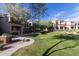 Beautiful lawn with BBQ and seating available for residents in courtyard area at 11375 E Sahuaro Dr # 2015, Scottsdale, AZ 85259
