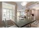 Open dining area with a table set for four, connecting to the living room and kitchen at 11375 E Sahuaro Dr # 2015, Scottsdale, AZ 85259