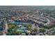 Aerial view of Stonegate community showing well-maintained homes, community pool, tennis courts, and desert surroundings at 11403 E Caron St, Scottsdale, AZ 85259