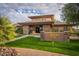 Exterior of the Stonegate clubhouse featuring manicured lawns, stone accents, and inviting entrance at 11403 E Caron St, Scottsdale, AZ 85259
