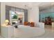Inviting living room with plush carpet, modern lighting, and sliding doors to the backyard at 11403 E Caron St, Scottsdale, AZ 85259